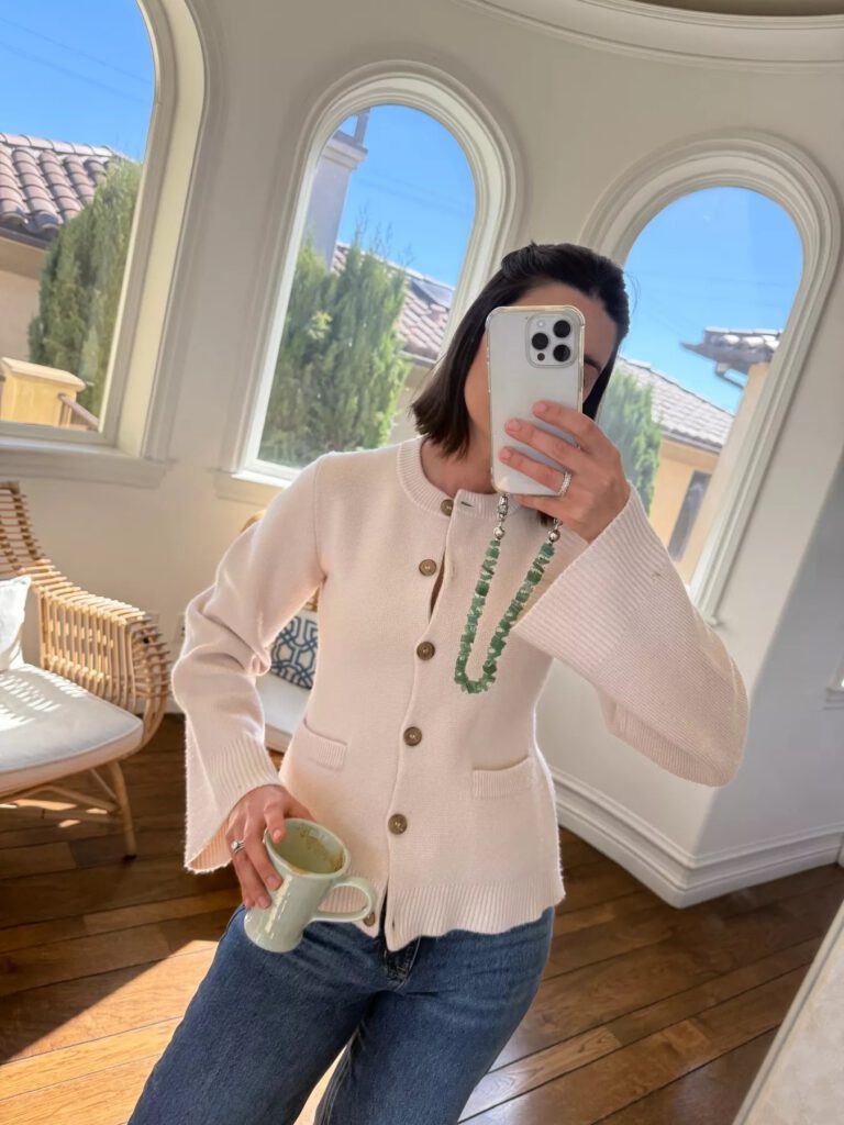 mary posing with coffee and phone